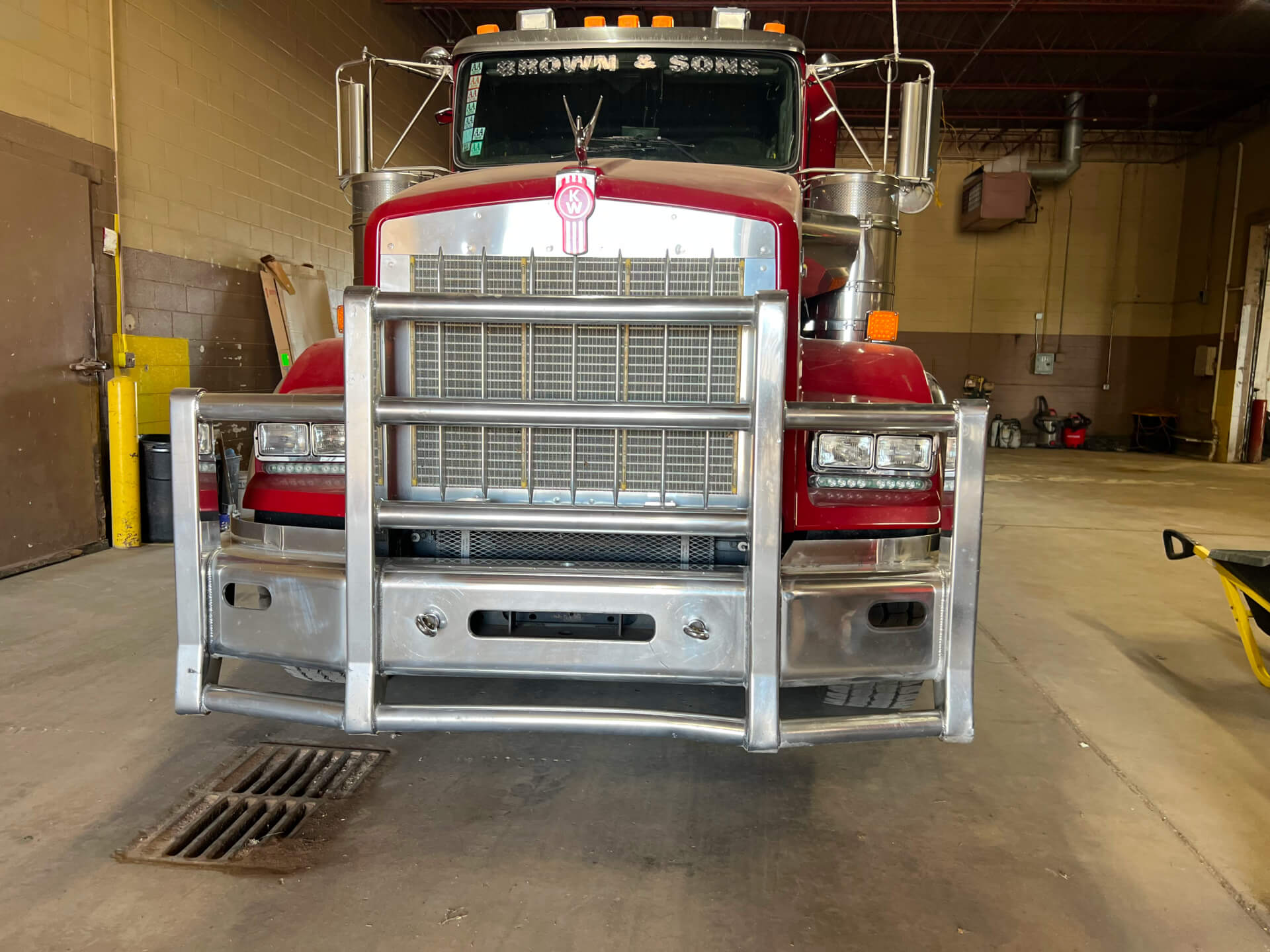 Front of a Brown & Sons service truck with warning lights on