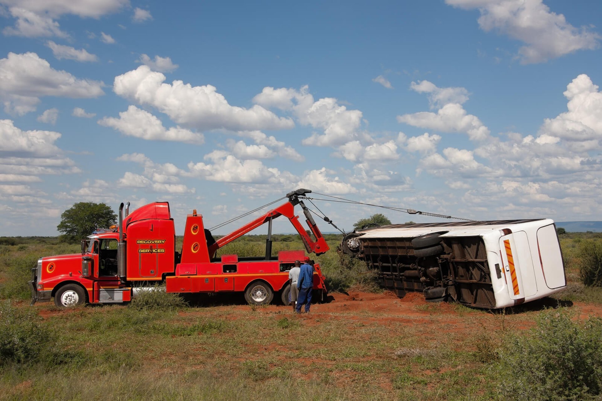 Overturned bus being uprighted during a Brown & Sons recovery
