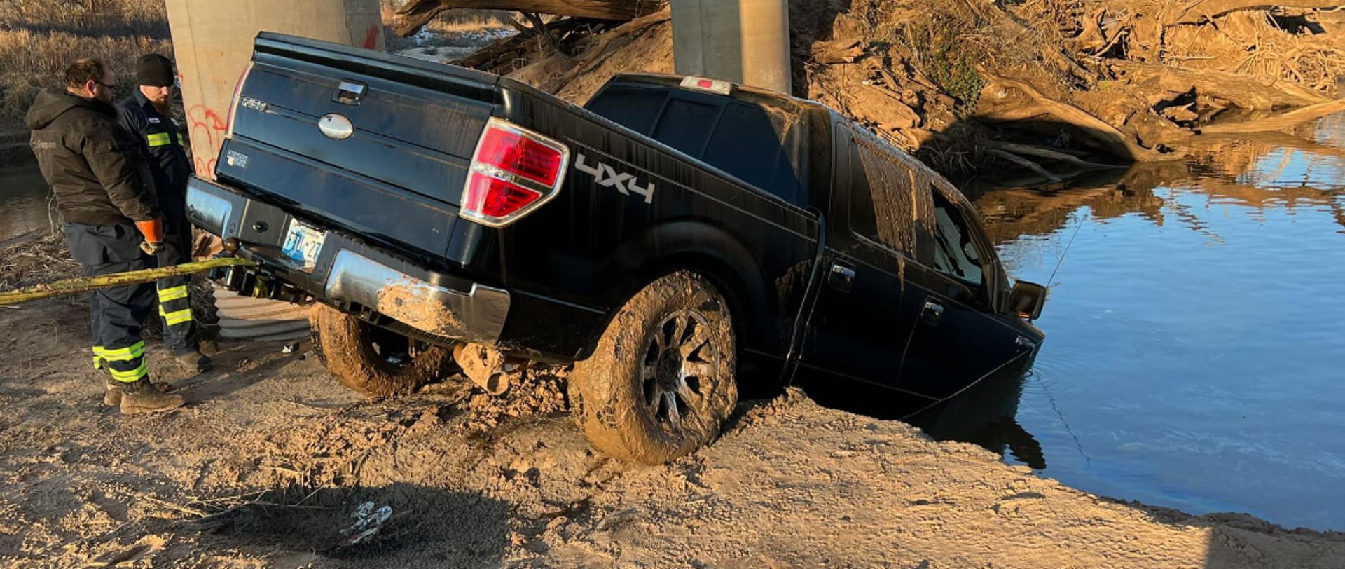 Pickup truck being winched out of water near Shawnee, Oklahoma